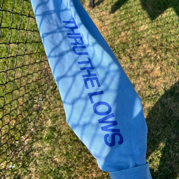 “Good Energy” hoodie in size large with wording “Thru the Lows” on one sleeve. - Picture 3 of 4